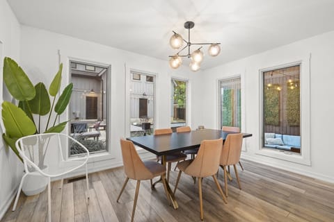 Gather around a stylish table in a dining area designed for memorable meals and conversations.