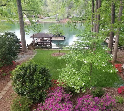 Wooded Backyard with private dock on a quiet cove.