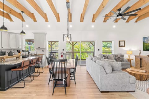 Open-concept living, dining, & kitchen with vaulted ceilings & stunning views!