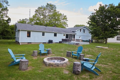 Backyard fire pit area with seating.