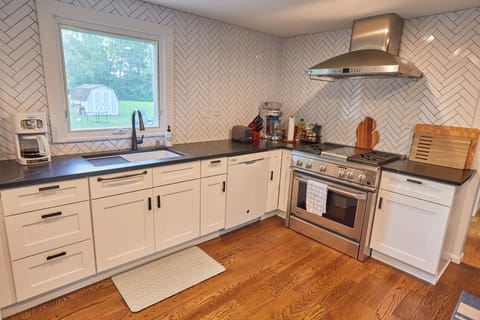 Kitchen with stove, oven, dishwasher and coffee maker.