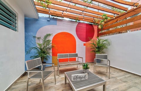 Enjoy an morning coffee or evening cocktail in the private veranda in the back of the house.