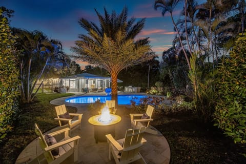 Unwind by the fire! End your perfect day gathered around the fire pit, set beneath the palms, overlooking the beautifully lit pool and house. Pure vacation bliss!
