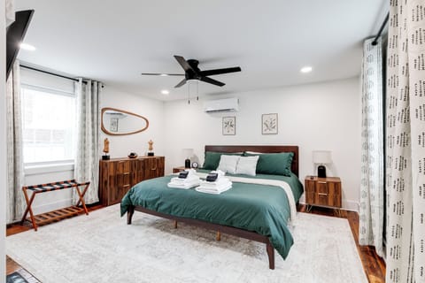 King Bedroom: Tranquil vibes with stylish decor and a plush king bed await your stay!