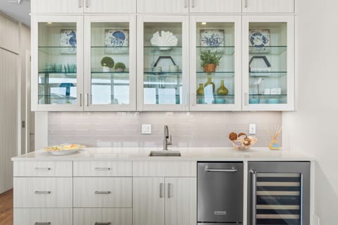 Wet bar with a wine fridge.