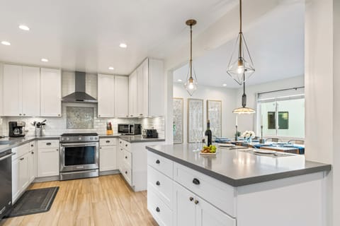 Spacious kitchen with a center island and modern finishes.