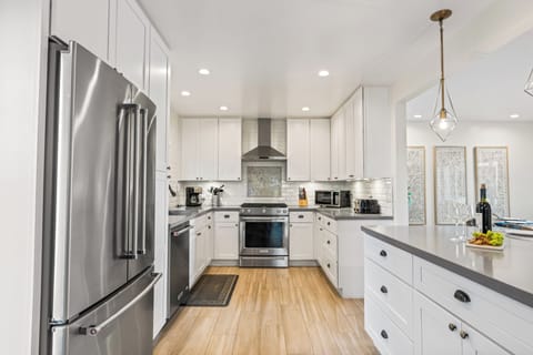 Fully equipped kitchen with stainless steel appliances.