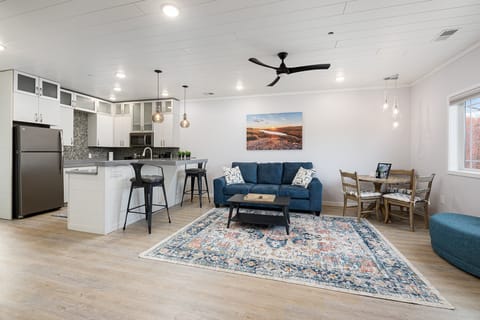 Bright, open, and beautifully designed — enjoy a full kitchen, cozy living room, and dining nook all in one welcoming space