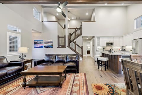 Game night in the cozy living room—spacious seating and warm lighting for family fun.