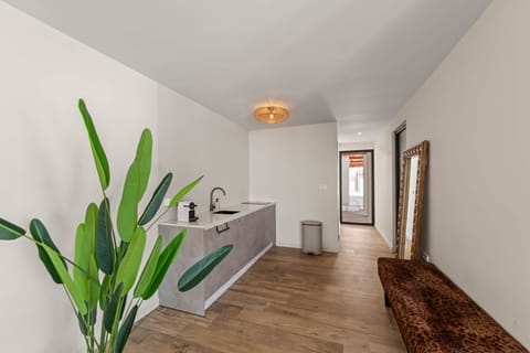 Kitchen with view of apartment entrance