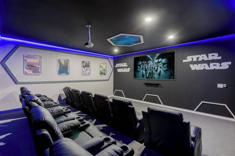 Full size movie theater w/ giant screen, surround sound & reclining chairs 