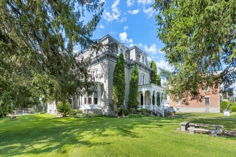 Grand historic estate with sprawling grounds and charming carriage house—perfect for gatherings and getaways.