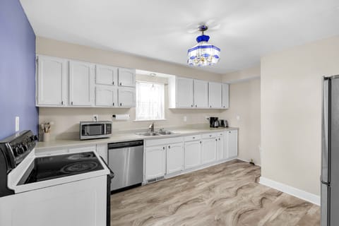 Your bright, fully-equipped kitchen awaits with modern appliances and ample counter space for preparing meals together.