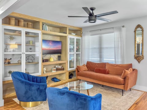 Relax in the comfortable living room. Enjoy the TV or books and games provided.