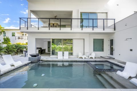 Outdoor Oasis: Relax by the pool and soak up the sun in this stylish retreat!