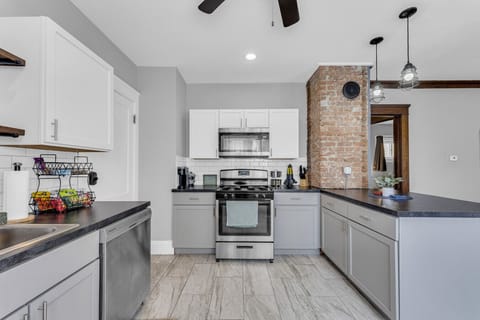 Clean, modern kitchen offering simple storage & a breezy layout.