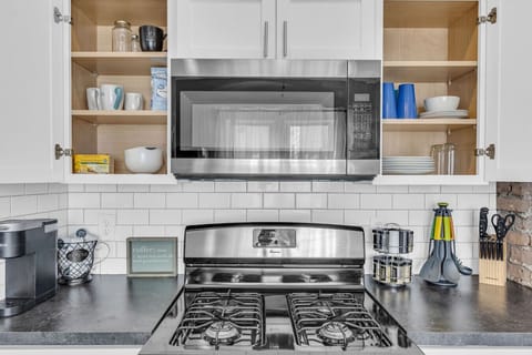 Streamlined kitchen offering bright workspace & essentials.