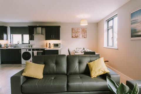 Open plan living room, dining room with kitchen
