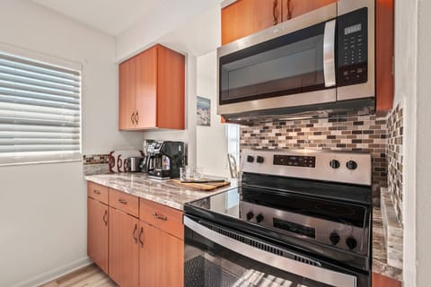 Kitchen | Fully equipped with stainless steel appliances and ample counter space