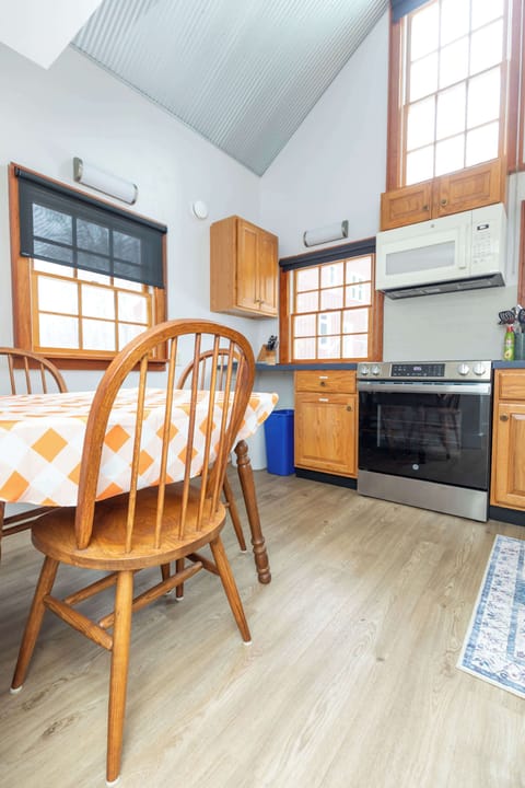 The kitchen has lots of natural light as well, a splendid place to enjoy a meal in!