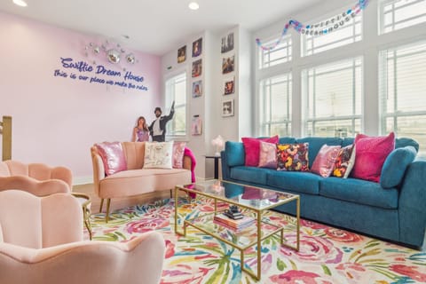 2nd Floor: Taylor Swift themed open-concept living area featuring a Smart TV, stylish furnishings and Taylor Swift decor.