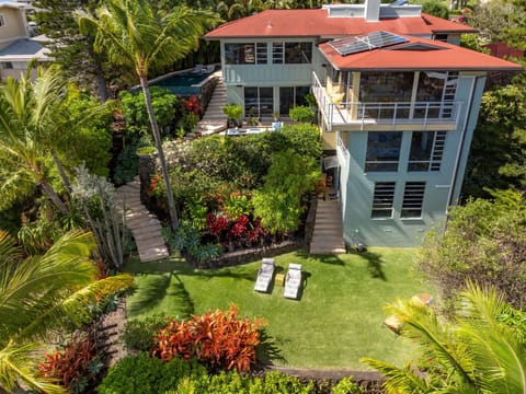 Beautiful hillside retreat with vibrant gardens and private pool.