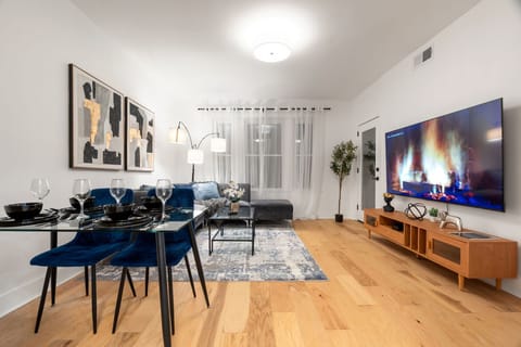 Dining & living area designed for easy nights in w/ entertainment.