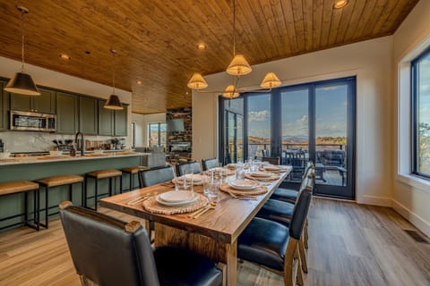 Share group meals at the live-edge dining table with a scenic backdrop of the hills