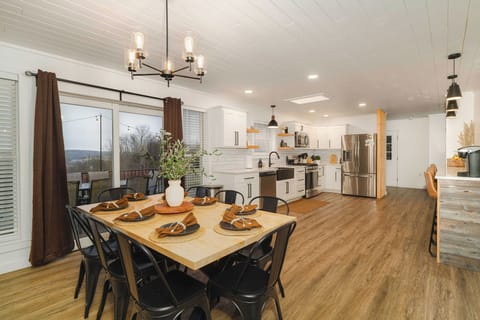 Bright, Spacious Farmhouse Kitchen & Dining Area. Perfect for family meals with mountain views and room for the whole group.