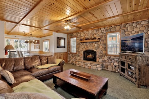 Cozy living room with plush sofa, filled with bright natural light and inviting warmth
