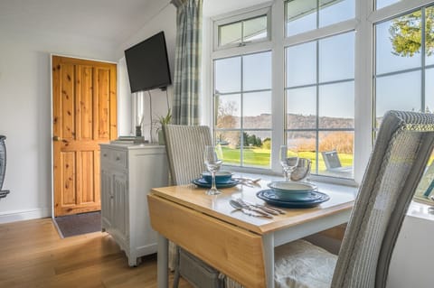 Dining table with lake view in 11 Priory Cottages in Windermere