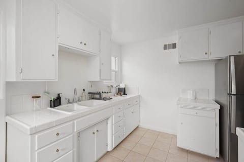 Quaint Kitchen Area for all your cooking needs:
-Gas Stove 
-Stainless Steel Fridge
-Farmhouse sink 