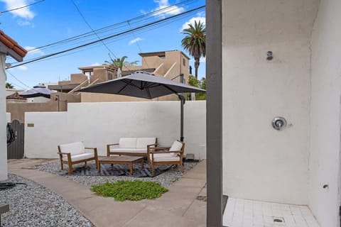 Outdoor Patio Space in the Shade! Enjoy this shared Space out in the sun! 
To the Right: Outdoor shower for surfers and beach Goers
