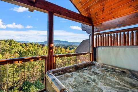 Soak your cares away in the bubbling hot tub while gazing out at endless layers of mountain peaks bathed in golden light.