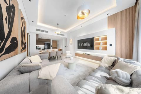 Stylish living area with seating, Smart TV, and balcony views