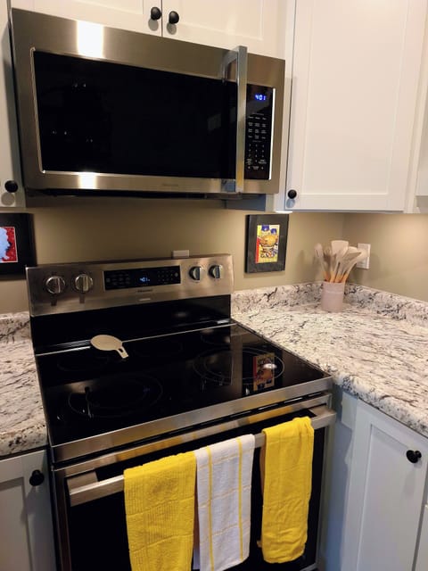 Brand new glass top range with an air fryer feature and microwave.