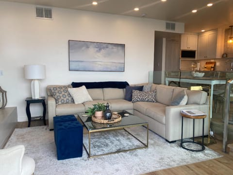 Cozy and serene living room with views of the ocean.
