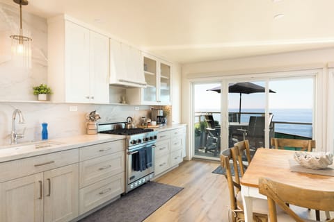 New kitchen with Quartite countertops and backsplash... full view to the beach.