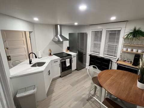Newly renovated kitchen with quartz counters and stainless steel appliances.