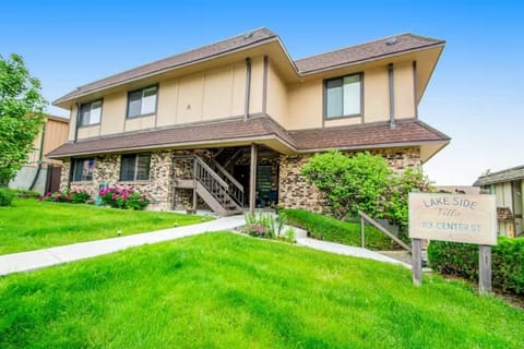 Lush green landscaped building exterior.