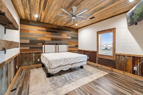 Bedroom #2 with a king-size bed & t.v.