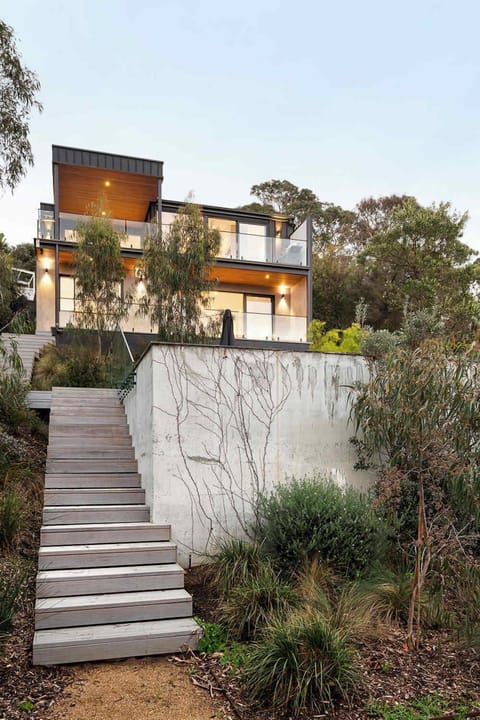 Stairs leading to the pool and to the house.