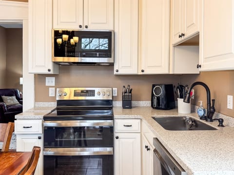 The spacious kitchen has all new appliances and everything you need, including an air fryer, crock pot and you will feel like your home at Aussie Cottage.