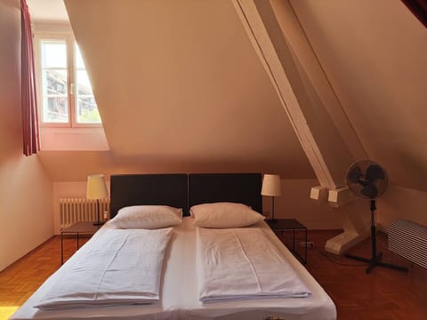 Spacious loft studio with bed and dining area