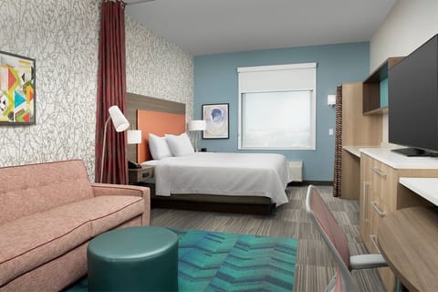 Unwind in a bright, modern room with cozy seating.