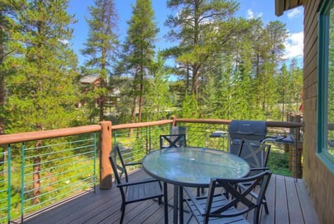 Breathe in the fresh mountain air as you sip your morning coffee on the serene deck, enveloped by towering pines.