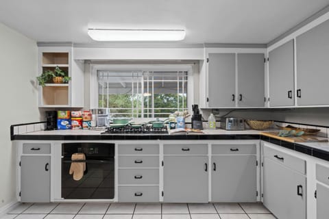 Kitchen offered full amenities and supplies for a convenient cooking experience.