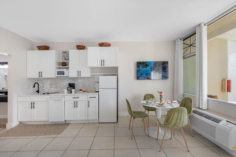 Fully equipped kitchen with stylish cabinetry and essentials for easy meals.