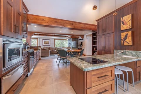 Nicely appointed kitchen with stainless appliances and additional table seating.