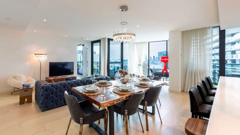 Bright open-plan living and dining space with city outlook.